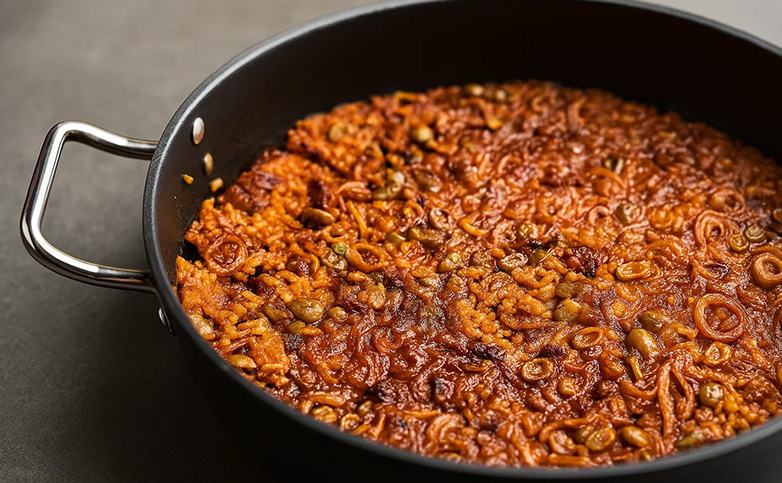 arroz seco de calamar y panceta con habitas
