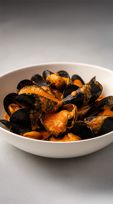 Clóchinas con tomate picante